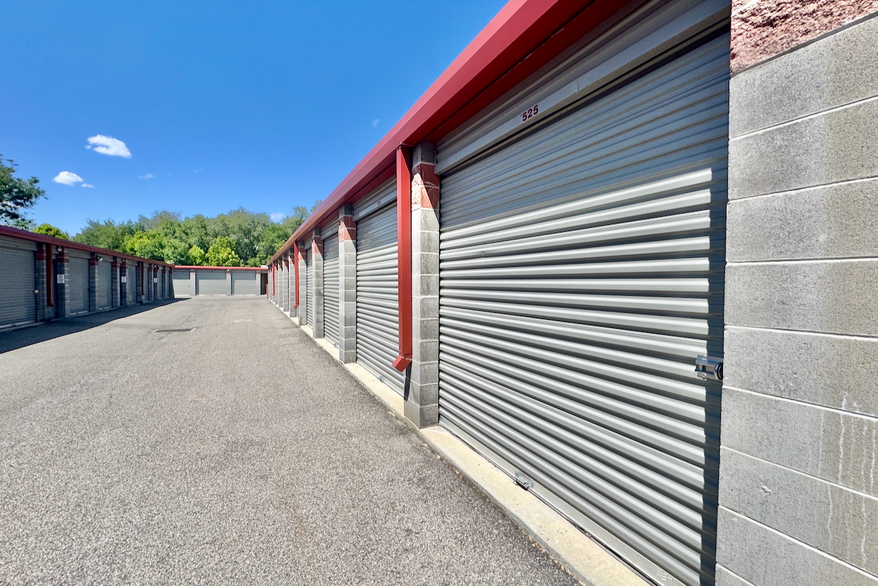 Outdoor drive-up storage units at Storage Depot, 1656 West Whitlock Avenue, West Valley, Utah, with ground floor access and security fence