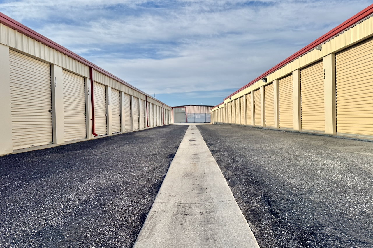 Outdoor drive-up storage at Storage Depot, 1656 West Whitlock Avenue, with security features and free lock included