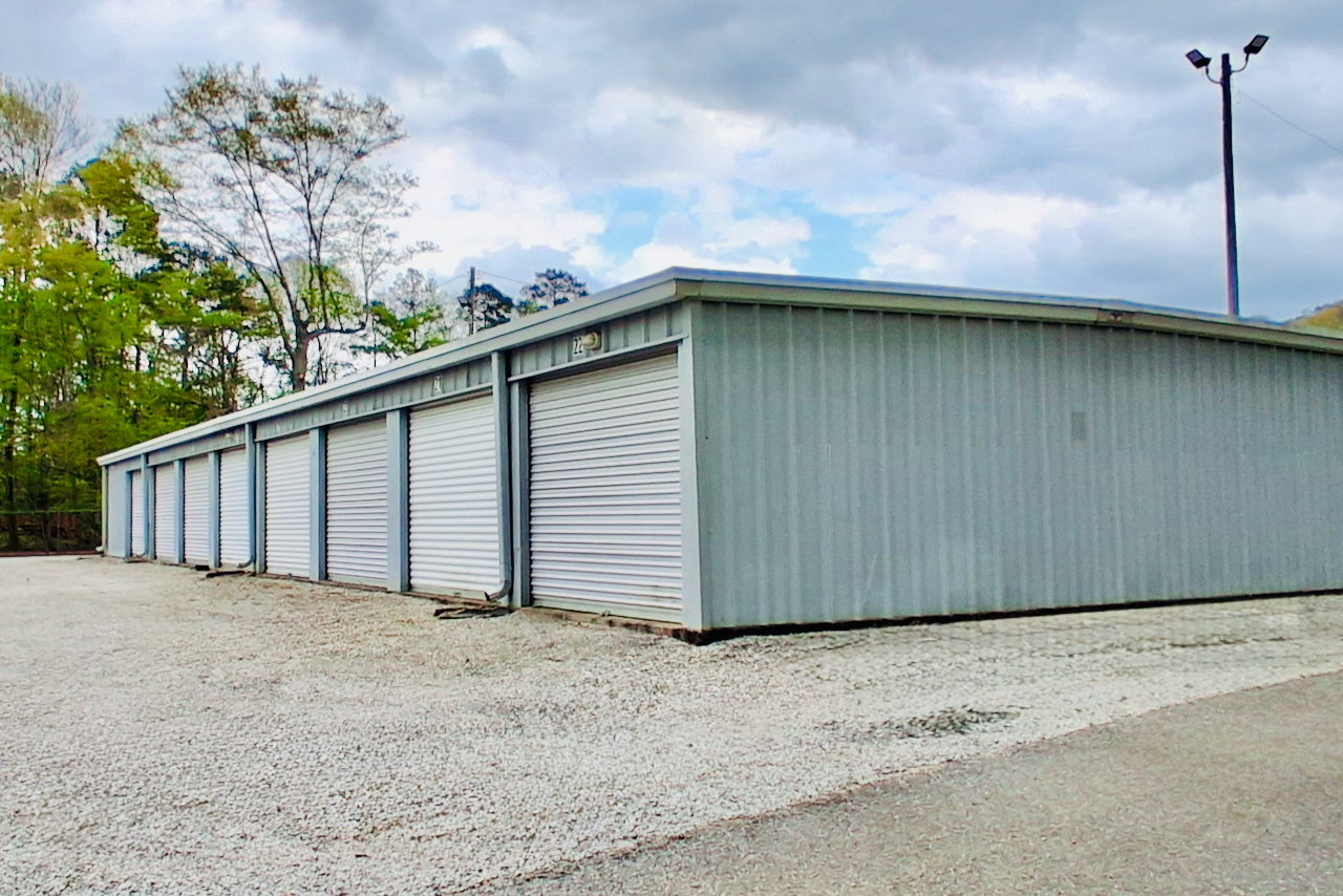 Row of drive-up storage units at Storage Depot in Birmingham, AL, ideal for household items and business inventory storage.
