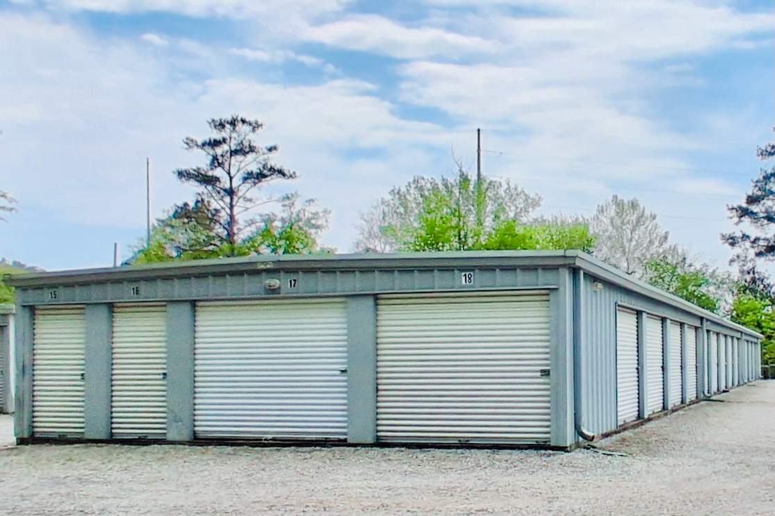 Outdoor drive-up storage units at Storage Depot on Cahaba Valley Road, Birmingham, AL, with easy vehicle access and secure fencing.