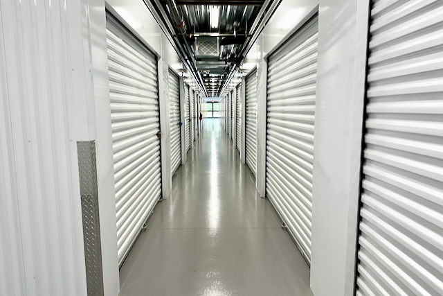 Interior hallway with storage unit doors at ModBox Storage in Mebane, North Carolina