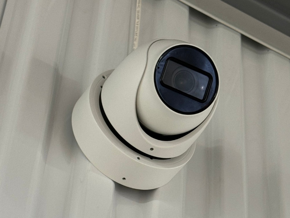 Security camera mounted inside storage facility