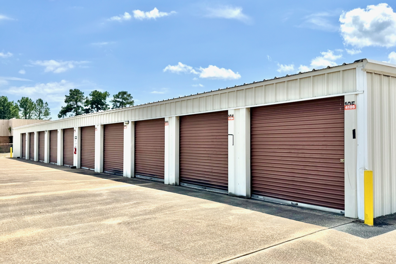 Roll-up doors on exterior drive-up units at local Mansfield storage, ideal for moving and relocation with protection plans